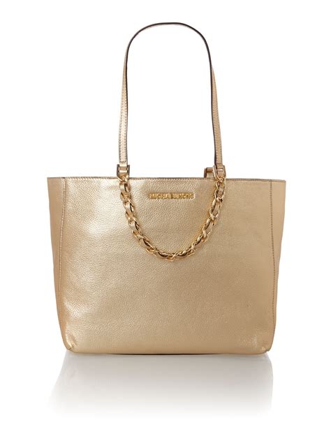 michael kors black and gold clutch|Michael Kors large gold tote.